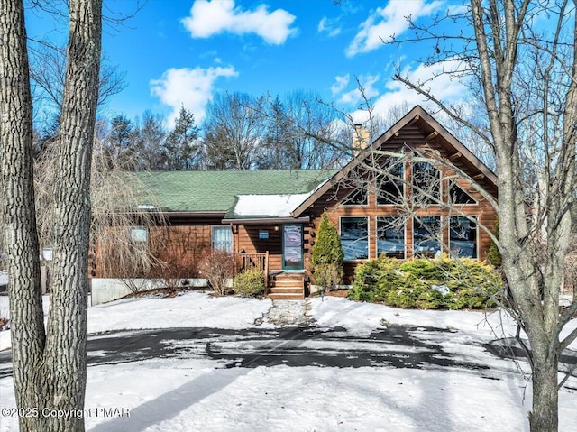 cabin featuring a chimney