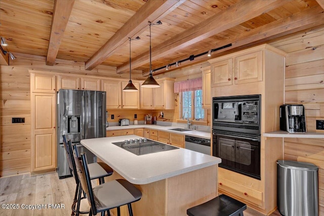 kitchen with sink, wood walls, wood ceiling, and black appliances