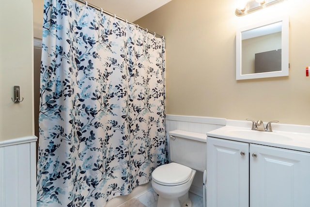 2227 Cheyenne Dr, Blakeslee, PA 18610 - bathroom featuring vanity, a shower with shower curtain, a wainscoted wall, and tile patterned floors