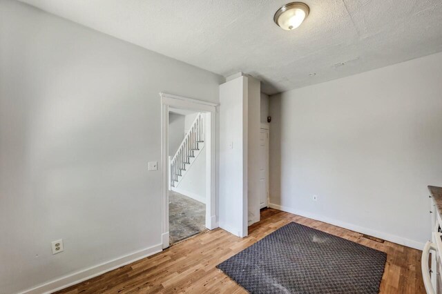 1198 W Main St, Stroudsburg, PA 18360 - empty room with light wood-type flooring and a textured ceiling