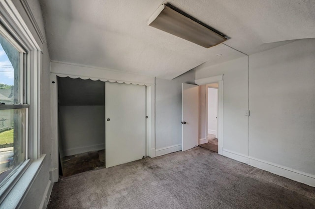 1198 W Main St, Stroudsburg, PA 18360 - unfurnished bedroom with carpet flooring, multiple windows, and a textured ceiling