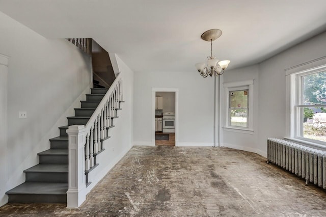 1198 W Main St, Stroudsburg, PA 18360 - foyer entrance featuring radiator, a chandelier, and stairway