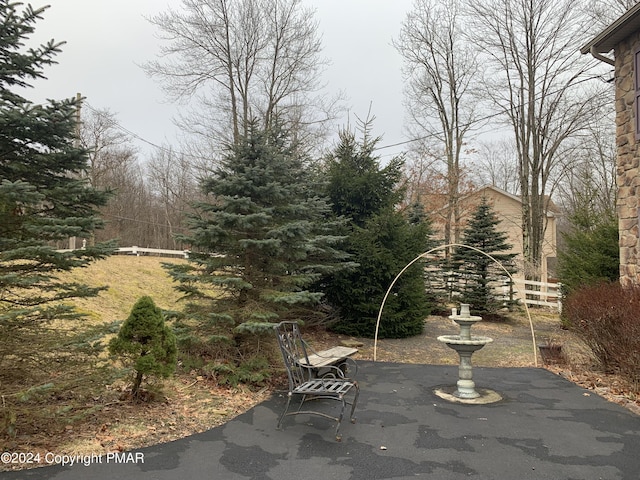 view of patio / terrace featuring fence