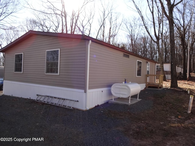 view of home's exterior with heating fuel