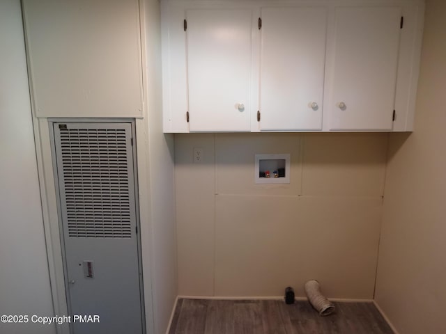 laundry area with hookup for a washing machine, dark wood-style floors, a heating unit, and cabinet space