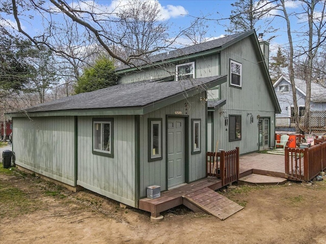 7924 Sleepy Hollow Dr, Tobyhanna, PA 18466 - rear view of property with a deck, a shingled roof, and a chimney