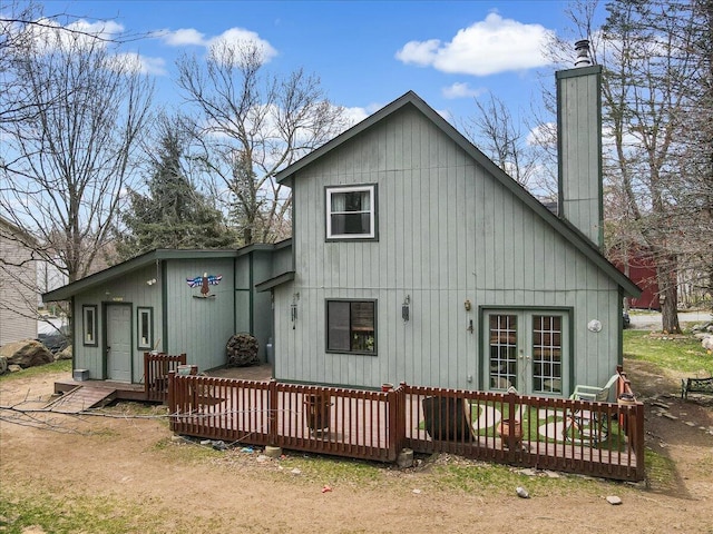 7924 Sleepy Hollow Dr, Tobyhanna, PA 18466 - back of property with french doors, a deck, and a chimney