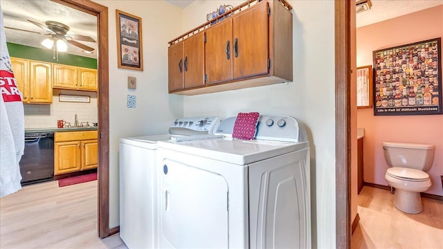 7924 Sleepy Hollow Dr, Tobyhanna, PA 18466 - laundry room with a ceiling fan, light wood-type flooring, a sink, baseboards, and washer and clothes dryer