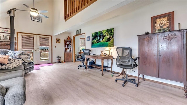 7924 Sleepy Hollow Dr, Tobyhanna, PA 18466 - home office with light wood-type flooring, a towering ceiling, ceiling fan, and french doors