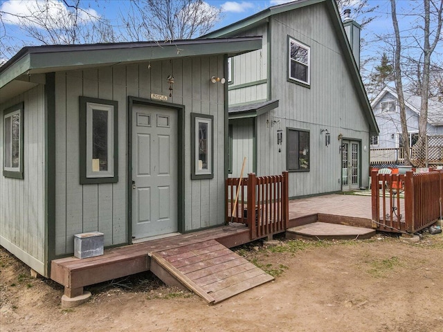 7924 Sleepy Hollow Dr, Tobyhanna, PA 18466 - back of property featuring a chimney and a deck