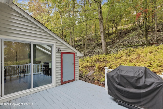 wooden terrace with area for grilling