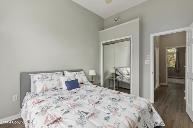 bedroom with baseboards, a closet, and wood finished floors