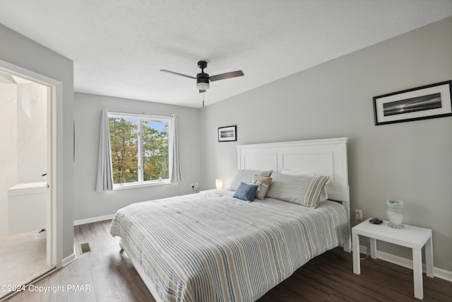 bedroom with a ceiling fan, baseboards, and wood finished floors