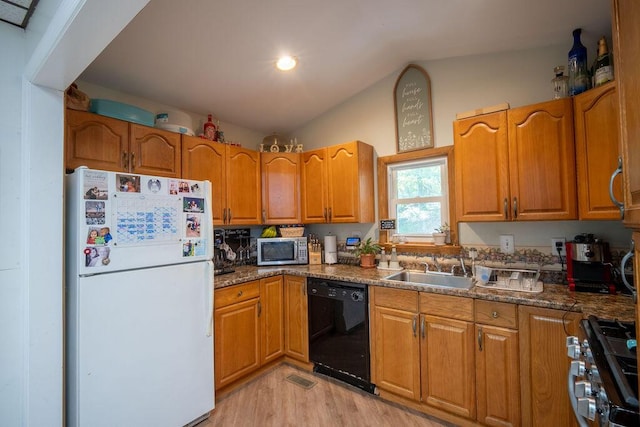 243 R Own Rd, East Stroudsburg, PA 18302 - kitchen featuring appliances with stainless steel finishes, lofted ceiling, light wood finished floors, and brown cabinetry
