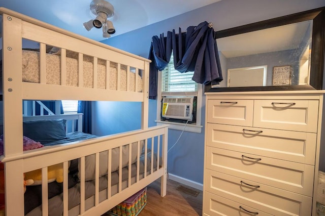 243 R Own Rd, East Stroudsburg, PA 18302 - bedroom featuring cooling unit and wood finished floors