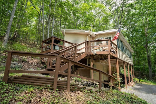 243 R Own Rd, East Stroudsburg, PA 18302 - wooden terrace with stairway and a forest view
