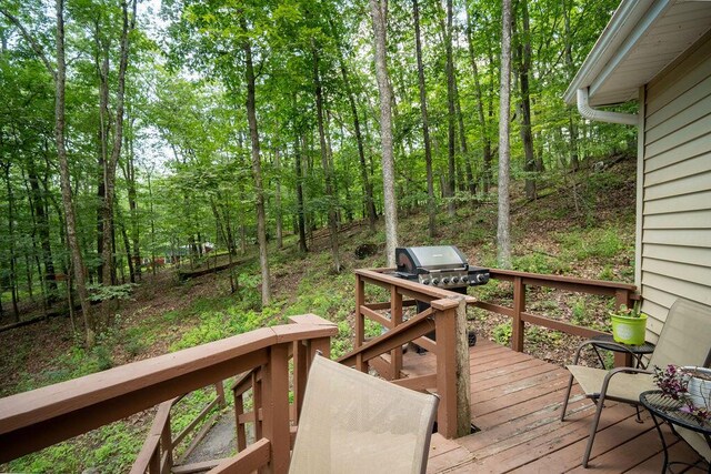 243 R Own Rd, East Stroudsburg, PA 18302 - wooden terrace featuring a wooded view