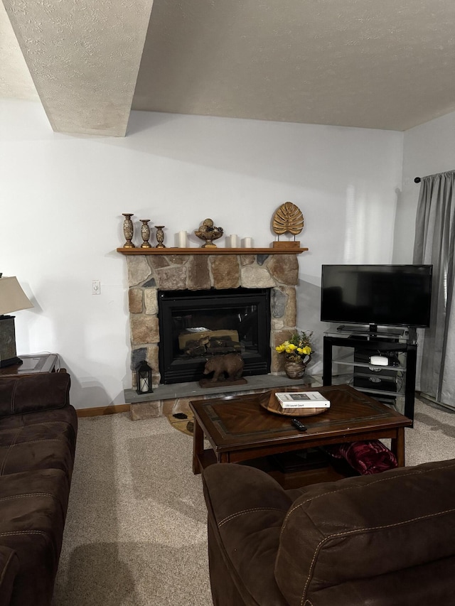 living area featuring a fireplace and carpet floors