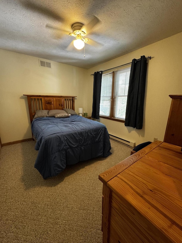 bedroom with baseboard heating, carpet, a textured ceiling, and ceiling fan