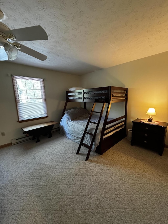 carpeted bedroom with a textured ceiling and ceiling fan