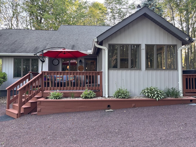1161 Deer, Pocono Pines, PA 18350 - view of front of house featuring roof with shingles, board and batten siding, and a chimney