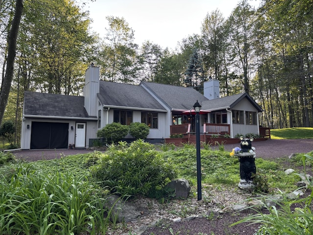 1161 Deer, Pocono Pines, PA 18350 - ranch-style home with a chimney, an attached garage, a deck, and driveway