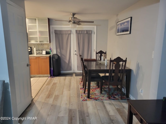 dining room featuring a ceiling fan and light wood-type flooring