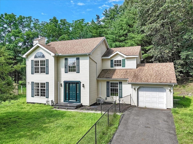 113 Dennis Ct, East Stroudsburg, PA 18301 - view of front of property with a garage, a chimney, asphalt driveway, and roof with shingles