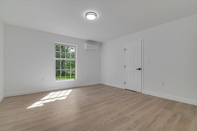 113 Dennis Ct, East Stroudsburg, PA 18301 - unfurnished room featuring an AC wall unit and light wood-style flooring