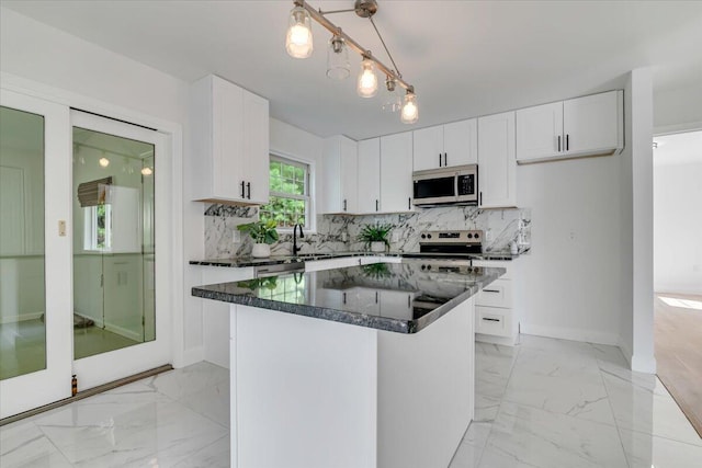 113 Dennis Ct, East Stroudsburg, PA 18301 - kitchen featuring light marble finish floors, white cabinets, and tasteful backsplash
