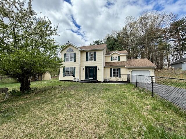 113 Dennis Ct, East Stroudsburg, PA 18301 - view of front of house with a garage, fence, a front lawn, and driveway