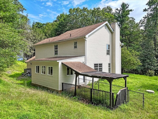 113 Dennis Ct, East Stroudsburg, PA 18301 - back of property featuring roof with shingles and a chimney