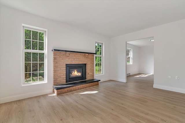 113 Dennis Ct, East Stroudsburg, PA 18301 - unfurnished living room featuring wood finished floors and a fireplace