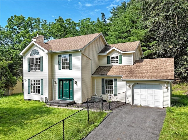 113 Dennis Ct, East Stroudsburg, PA 18301 - view of front of house featuring a garage, a chimney, asphalt driveway, and a shingled roof