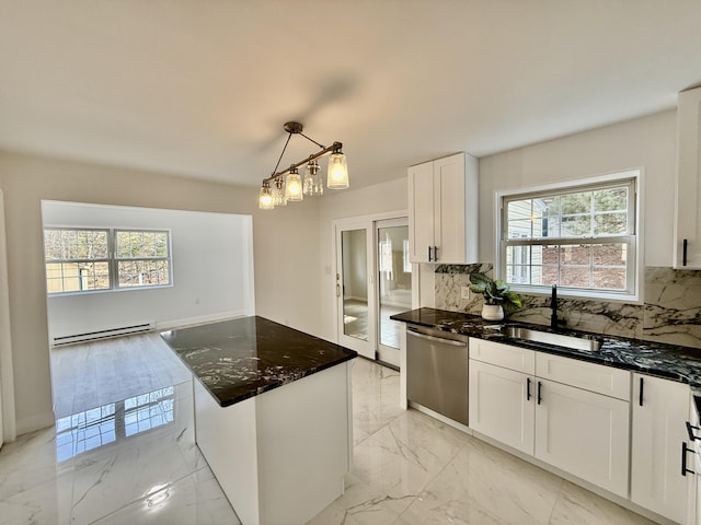 kitchen with a sink, marble finish floor, stainless steel dishwasher, baseboard heating, and dark stone countertops