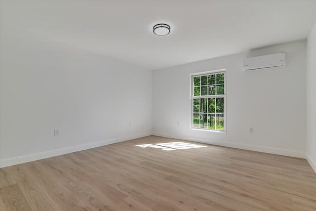 113 Dennis Ct, East Stroudsburg, PA 18301 - empty room with a wall unit AC and light wood-type flooring