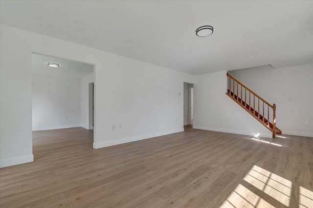 113 Dennis Ct, East Stroudsburg, PA 18301 - unfurnished living room featuring wood finished floors and stairs