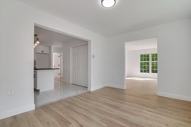 113 Dennis Ct, East Stroudsburg, PA 18301 - empty room with light wood-style floors and baseboards