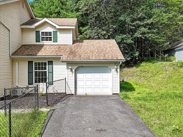 113 Dennis Ct, East Stroudsburg, PA 18301 - view of front of house with a garage, driveway, and roof with shingles