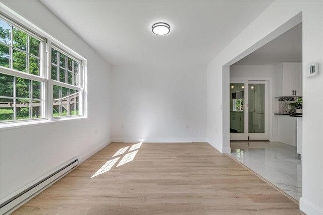 113 Dennis Ct, East Stroudsburg, PA 18301 - empty room with a baseboard radiator and light wood-style floors