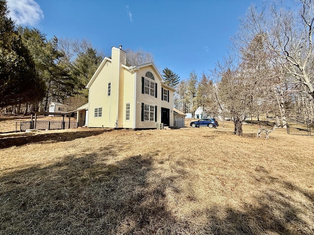 view of side of property featuring a chimney