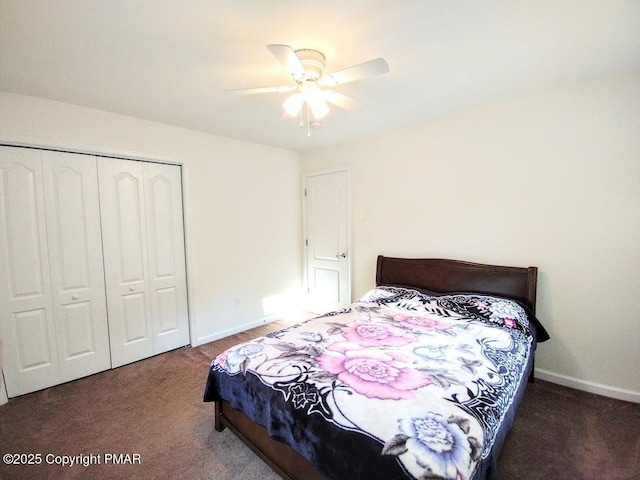 bedroom featuring ceiling fan, dark carpet, and a closet