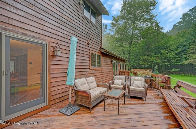 wooden terrace featuring an outdoor hangout area