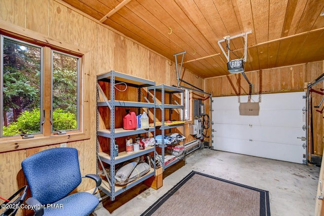 garage with wood ceiling, a garage door opener, and wood walls