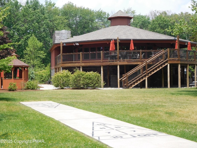 back of property with a yard