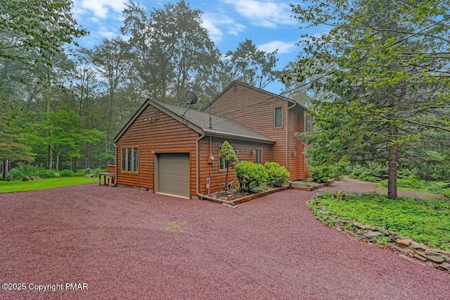 view of side of home with a garage