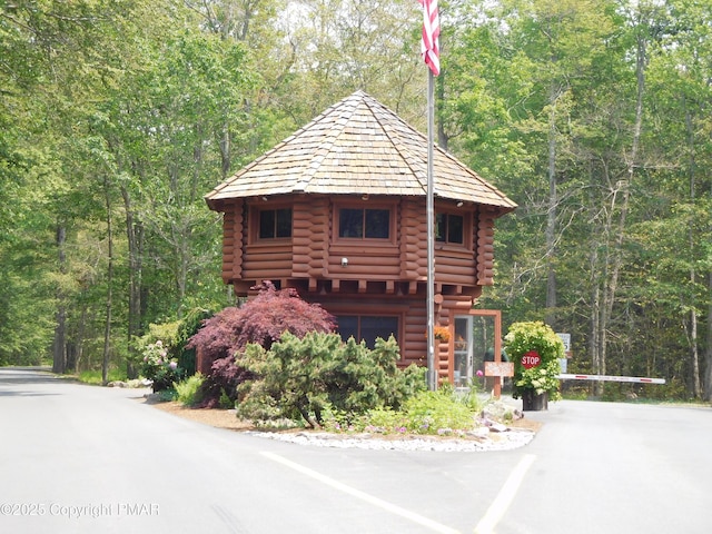 log-style house featuring a garage