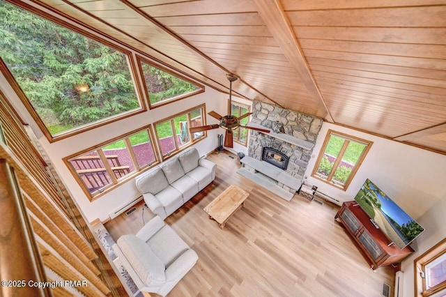 unfurnished living room featuring wood-type flooring, a fireplace, beam ceiling, and wooden ceiling