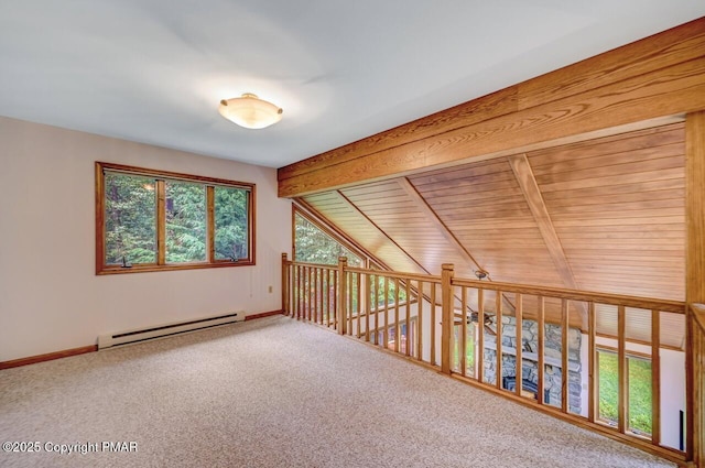 spare room featuring carpet floors, vaulted ceiling with beams, and a baseboard radiator