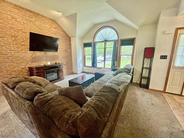350 Brier Crest Rd, Blakeslee, PA 18610 - carpeted living area featuring baseboards, a glass covered fireplace, and vaulted ceiling
